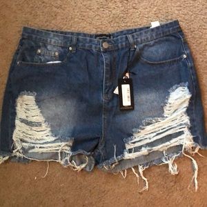 plus mid wash extreme ripped mom shorts